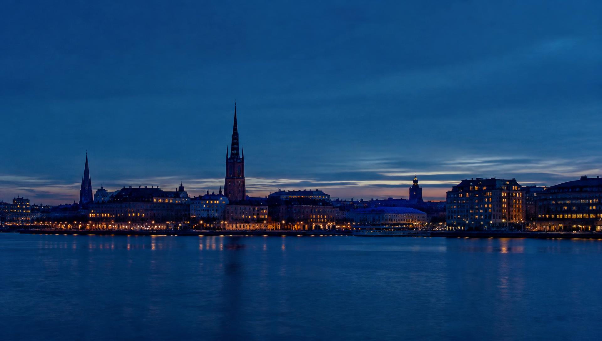Stockholm's skyline across the water at blue hour